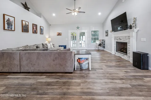 a living room with furniture and a fireplace