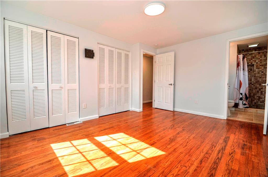 1313 Star Ridge Drive Pittsburgh, PA 15241 - Photo 21 of 36 a view of an empty room with wooden floor and a window