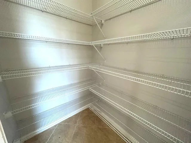 a view of a room with an empty walk in closet