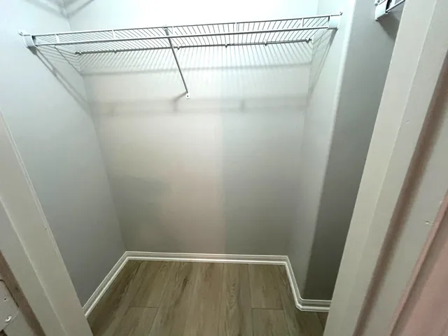 a view of a room with racks on the wall