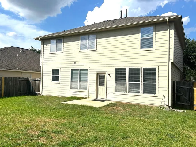 a house that has a big yard in front of it