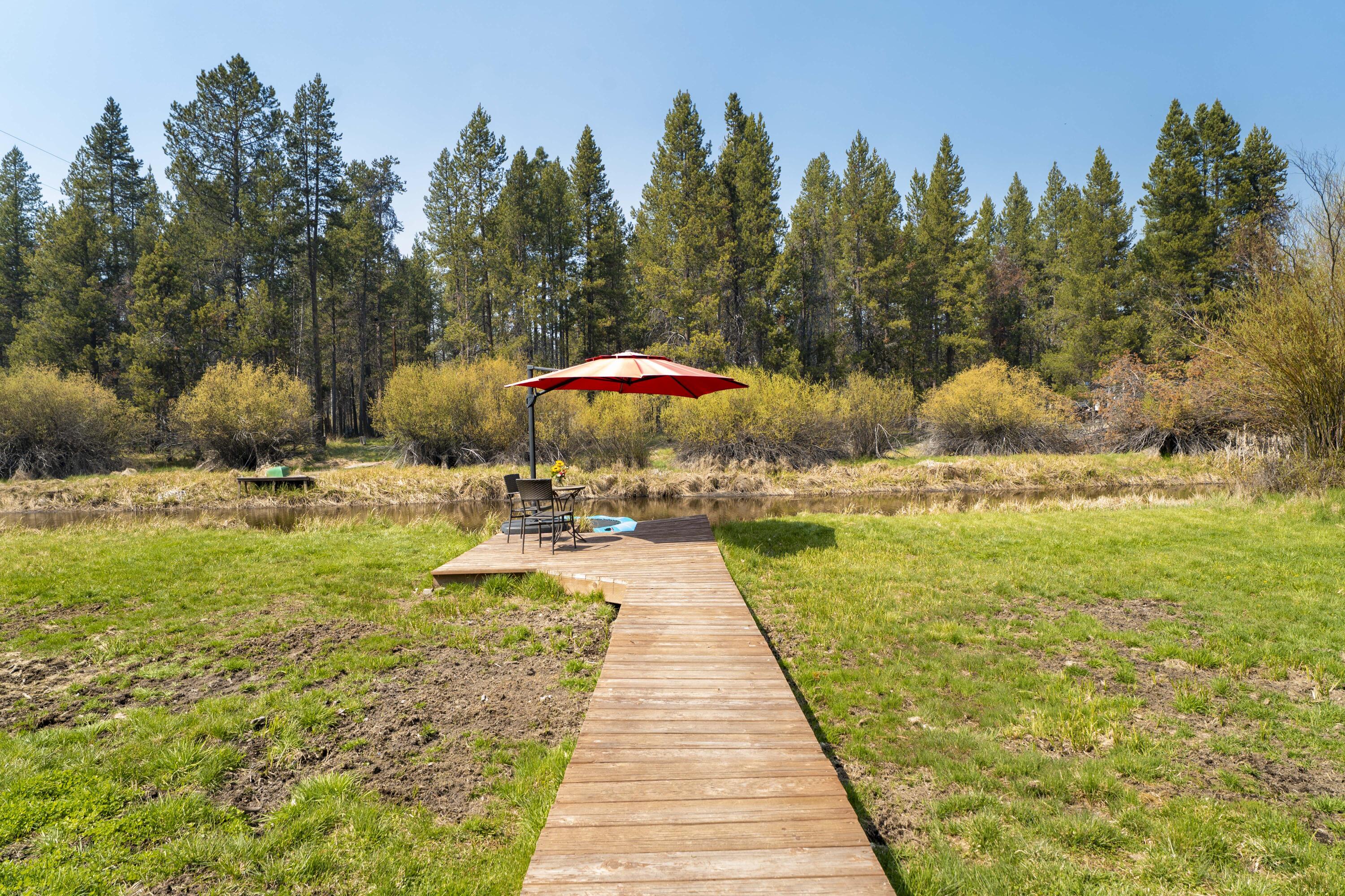 17062 Milky Way Bend, OR 97707 - Photo 4 of 39 Boardwalk leads from the lawn to the private waterfront seating