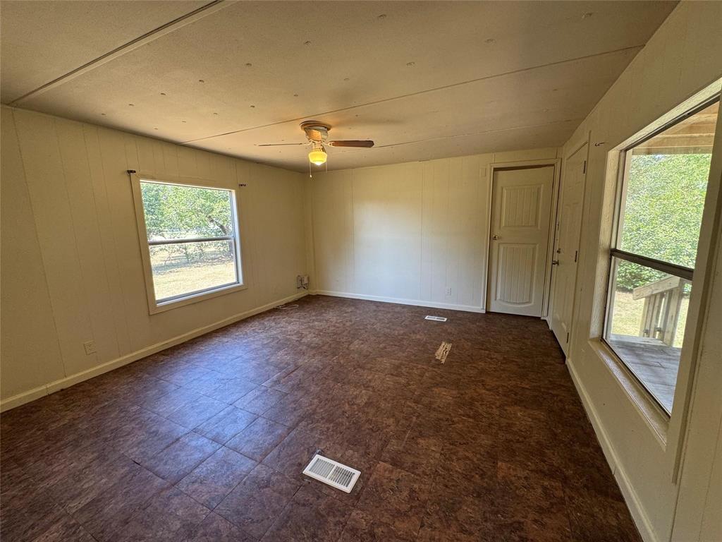 2010 Spring Court, Unit A Azle, TX 76020 - Photo 17 of 29 an empty room with windows