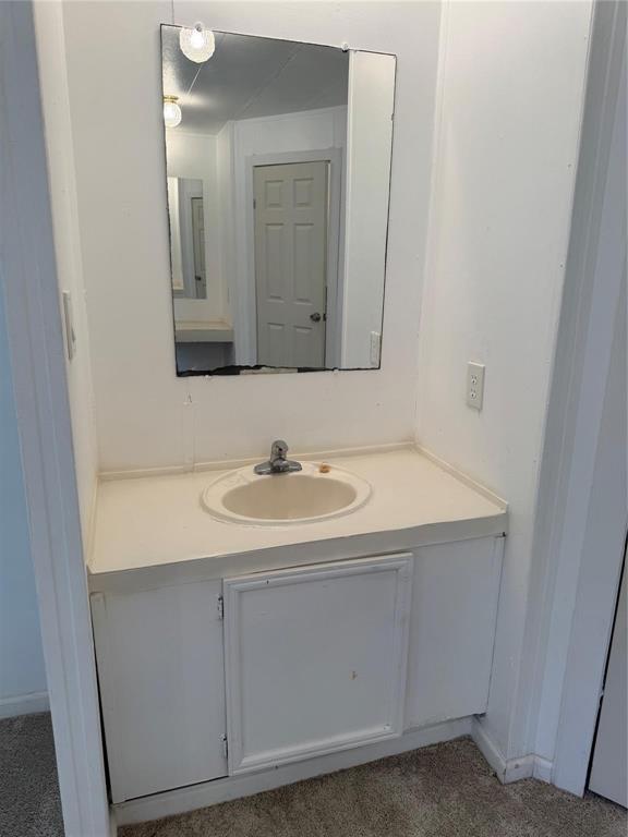 2010 Spring Court, Unit A Azle, TX 76020 - Photo 8 of 29 a bathroom with a sink and a mirror