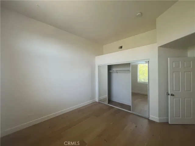 an empty room with closet area