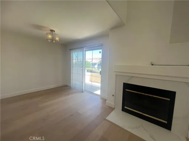 a view of empty room with a fireplace