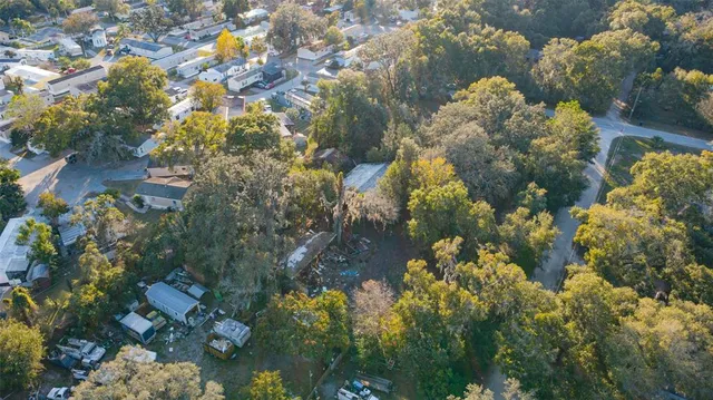 a backyard of a house with lots of green space and fountain