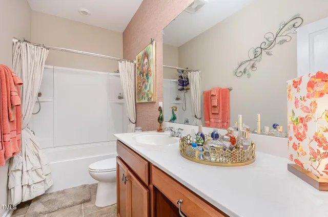 a view of a room with gym equipment and a window