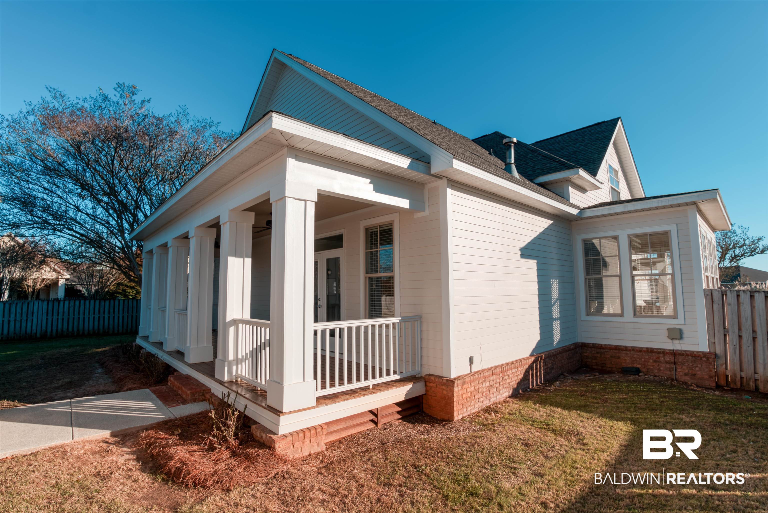 24561 Austin Road Daphne, AL 36526 - Photo 47 of 57 View of property exterior with a lawn and a porch