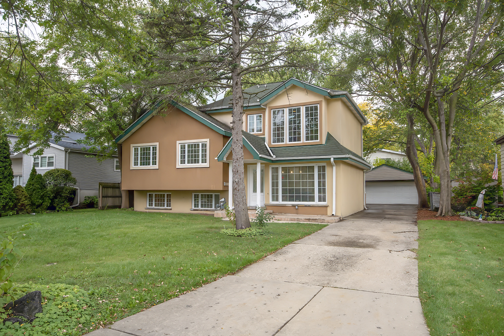 216 Flora Avenue Glenview, IL 60025 - Photo 1 of 40 a view of a yard in front of house