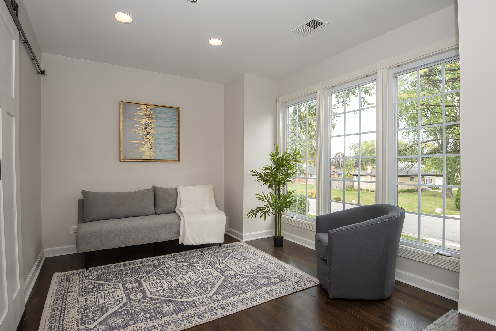 216 Flora Avenue Glenview, IL 60025 - Photo 14 of 40 a living room with furniture and a potted plant