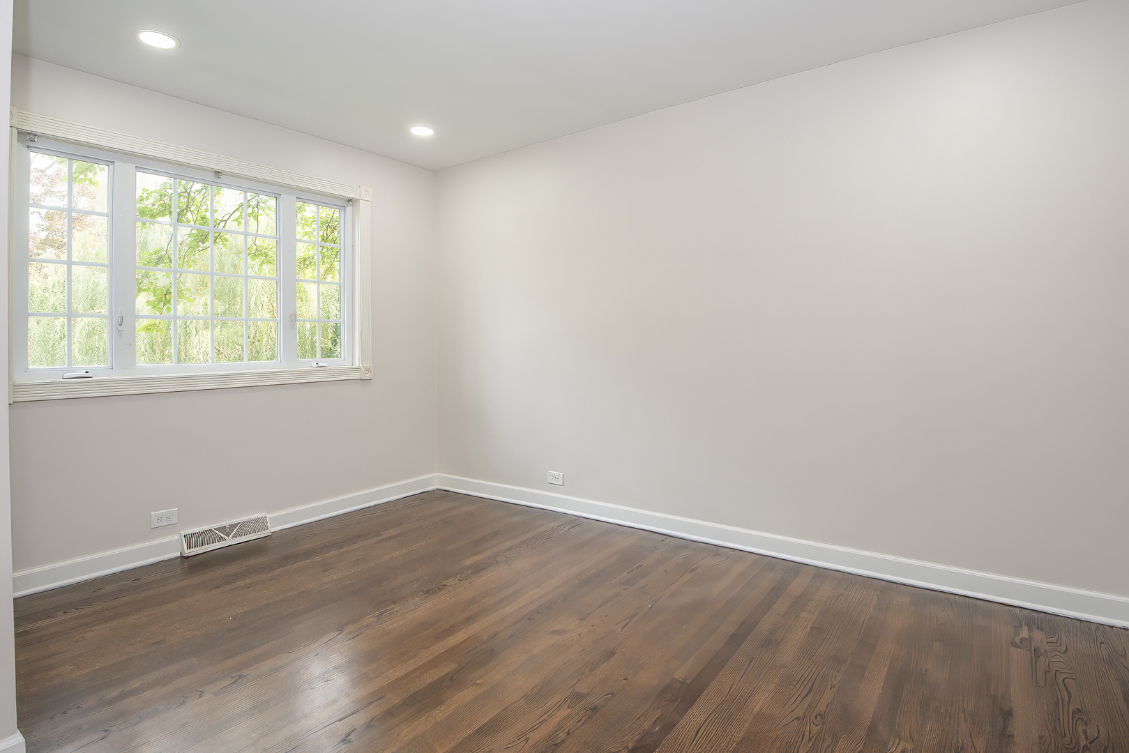 216 Flora Avenue Glenview, IL 60025 - Photo 29 of 40 an empty room with wooden floor and windows