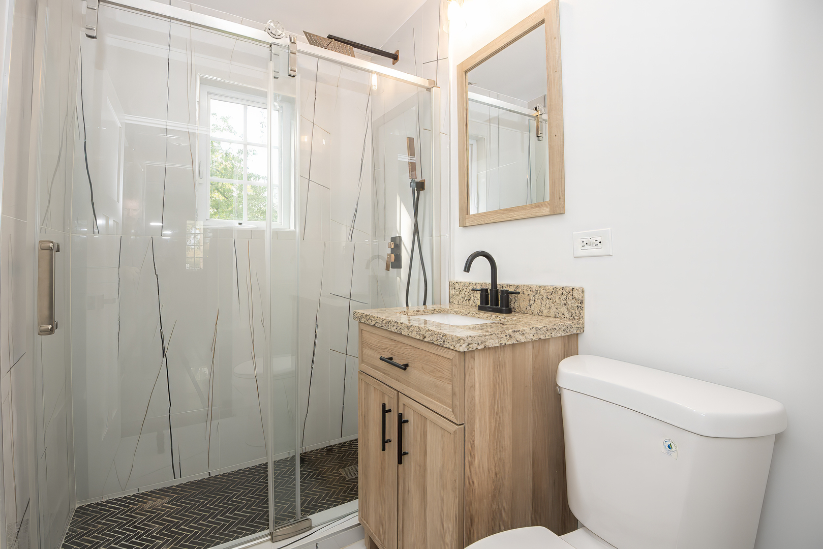 216 Flora Avenue Glenview, IL 60025 - Photo 30 of 40 a bathroom with a granite countertop sink toilet and shower