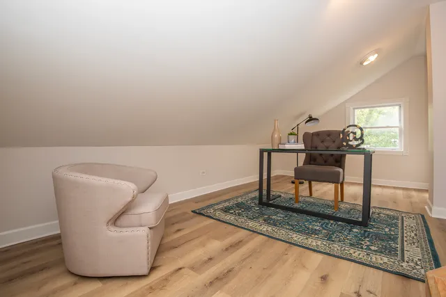 a living room with furniture and a rug