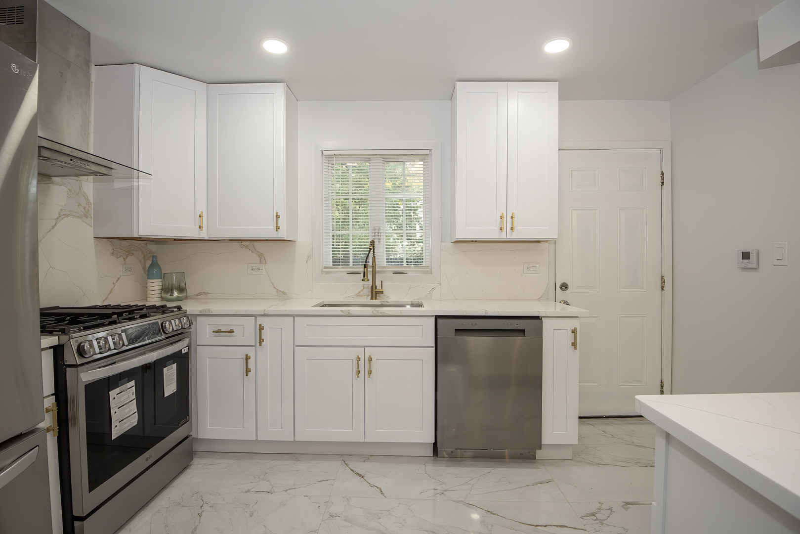 216 Flora Avenue Glenview, IL 60025 - Photo 9 of 40 a kitchen with granite countertop cabinets stainless steel appliances and a sink