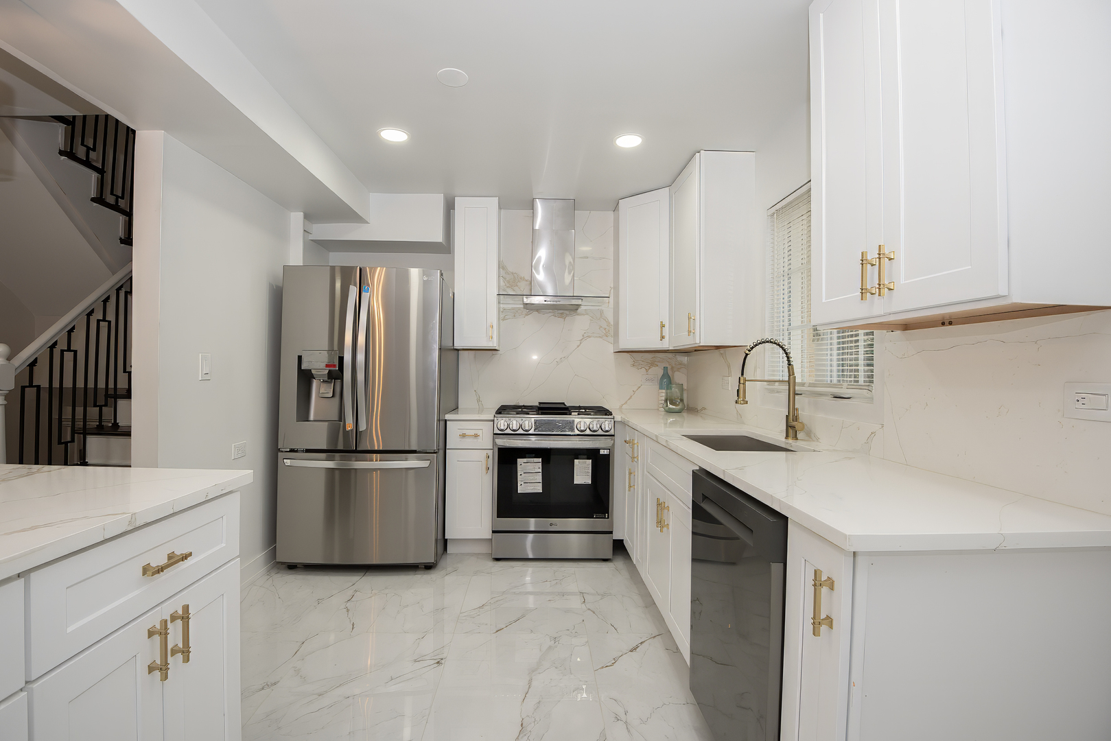 216 Flora Avenue Glenview, IL 60025 - Photo 10 of 40 a kitchen with a sink appliances and cabinets
