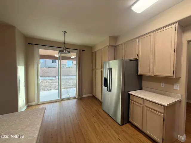 a kitchen with stainless steel appliances a sink stove and refrigerator