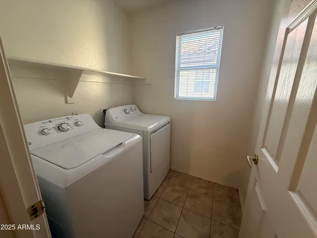 an empty room with closet area