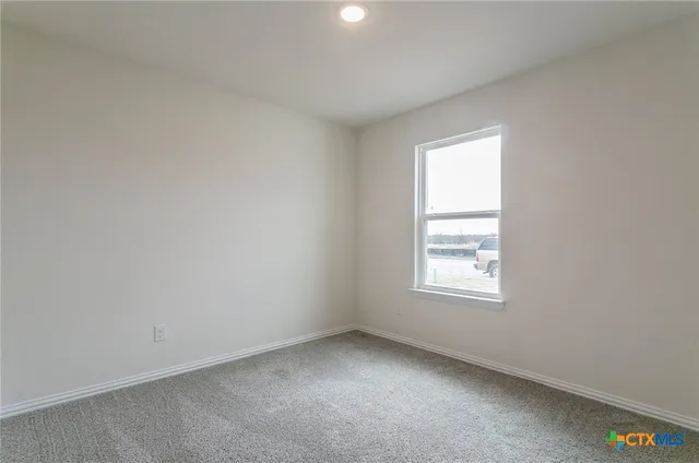 a bathroom with a shower and a glass door