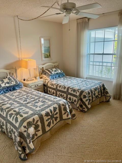 1858 Southwest Palm City Road, Unit 203 Stuart, FL 34994 - Photo 12 of 29 a bedroom with two bed and a window