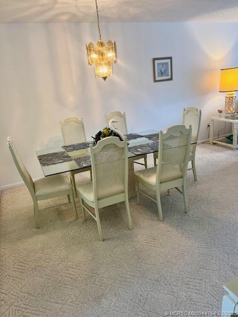 1858 Southwest Palm City Road, Unit 203 Stuart, FL 34994 - Photo 16 of 29 a view of a dining room with furniture