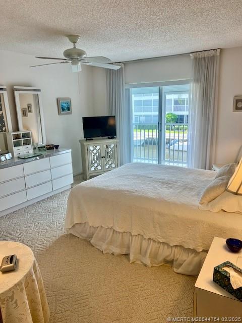 1858 Southwest Palm City Road, Unit 203 Stuart, FL 34994 - Photo 18 of 29 a bedroom with a bed and a large mirror