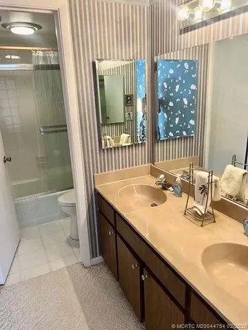 a bathroom with a shower and a toilet