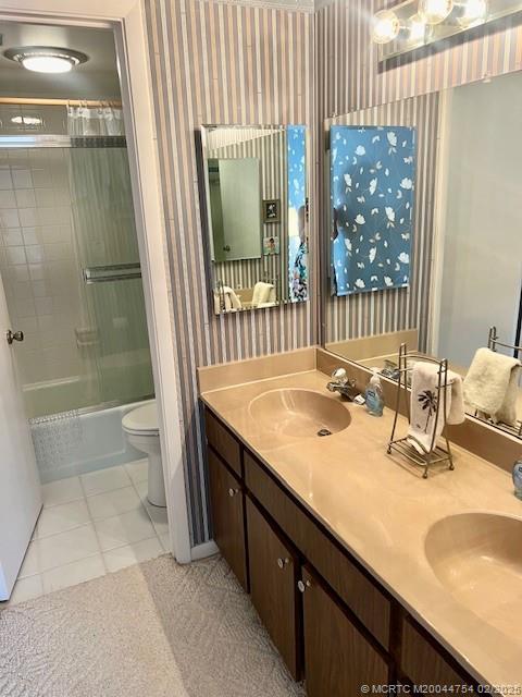 1858 Southwest Palm City Road, Unit 203 Stuart, FL 34994 - Photo 19 of 29 a bathroom with a granite countertop sink and a mirror