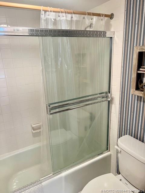 1858 Southwest Palm City Road, Unit 203 Stuart, FL 34994 - Photo 20 of 29 a bathroom with a shower and a toilet