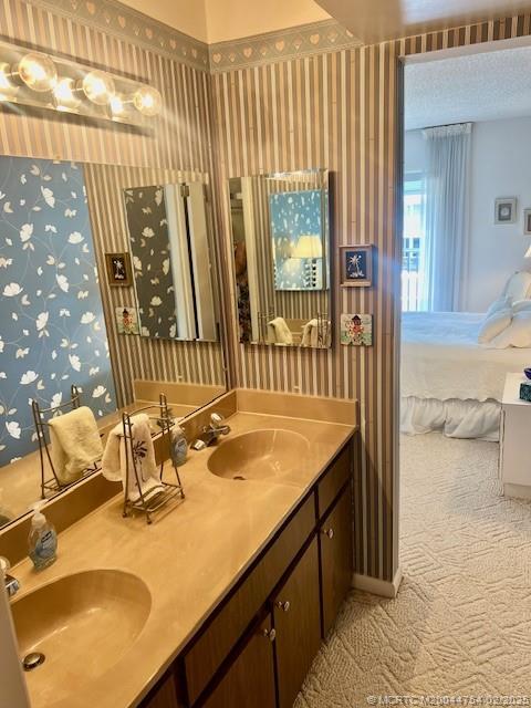 1858 Southwest Palm City Road, Unit 203 Stuart, FL 34994 - Photo 21 of 29 a bathroom with a sink and a mirror