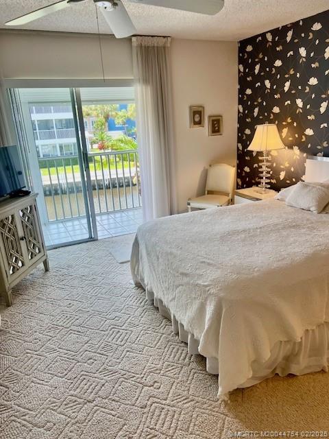 1858 Southwest Palm City Road, Unit 203 Stuart, FL 34994 - Photo 23 of 29 a bed sitting in a bedroom next to a window