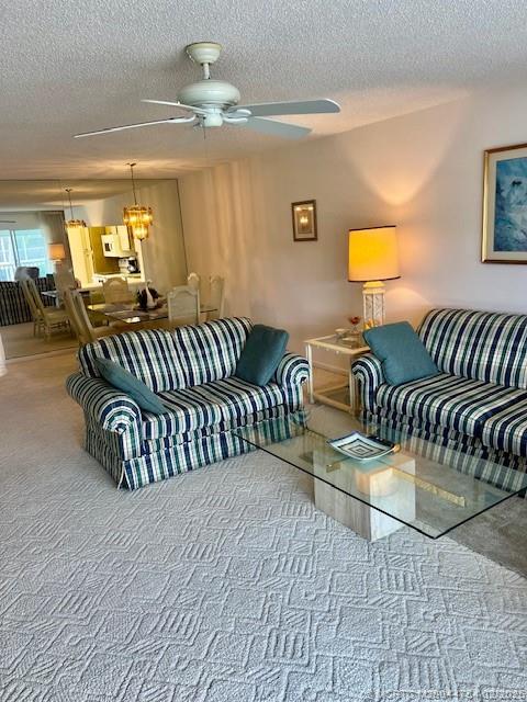 1858 Southwest Palm City Road, Unit 203 Stuart, FL 34994 - Photo 26 of 29 a bedroom with double bed and a couch