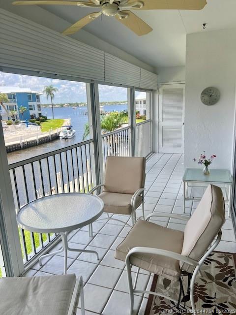 1858 Southwest Palm City Road, Unit 203 Stuart, FL 34994 - Photo 27 of 29 a view of a dining room with furniture window and outside view