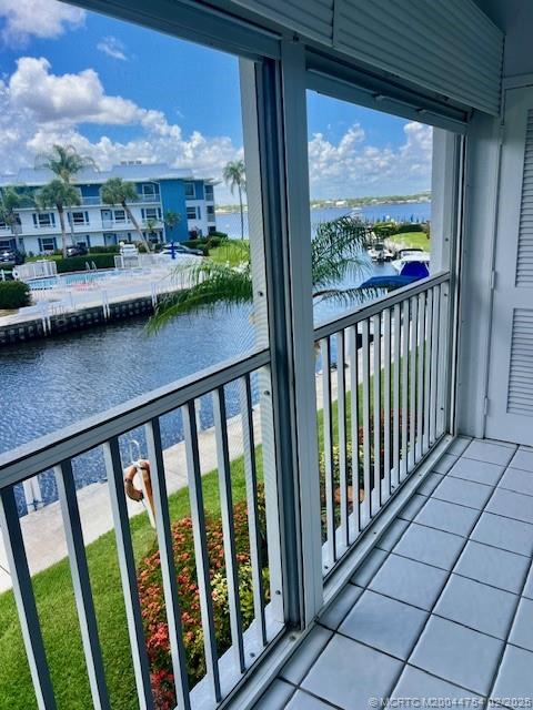 1858 Southwest Palm City Road, Unit 203 Stuart, FL 34994 - Photo 5 of 29 a view of a balcony with city view