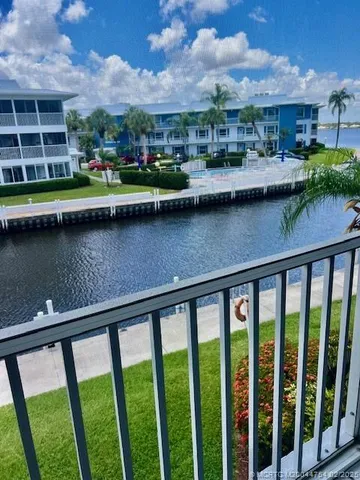 a kitchen with stainless steel appliances a refrigerator sink and cabinets