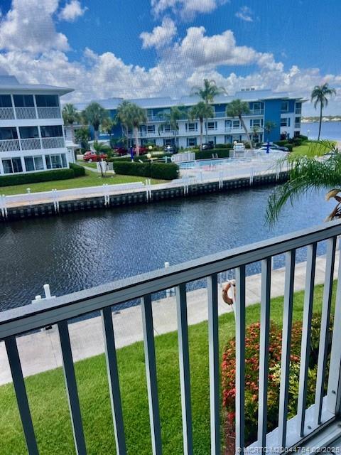 1858 Southwest Palm City Road, Unit 203 Stuart, FL 34994 - Photo 7 of 29 a view of a lake from a balcony