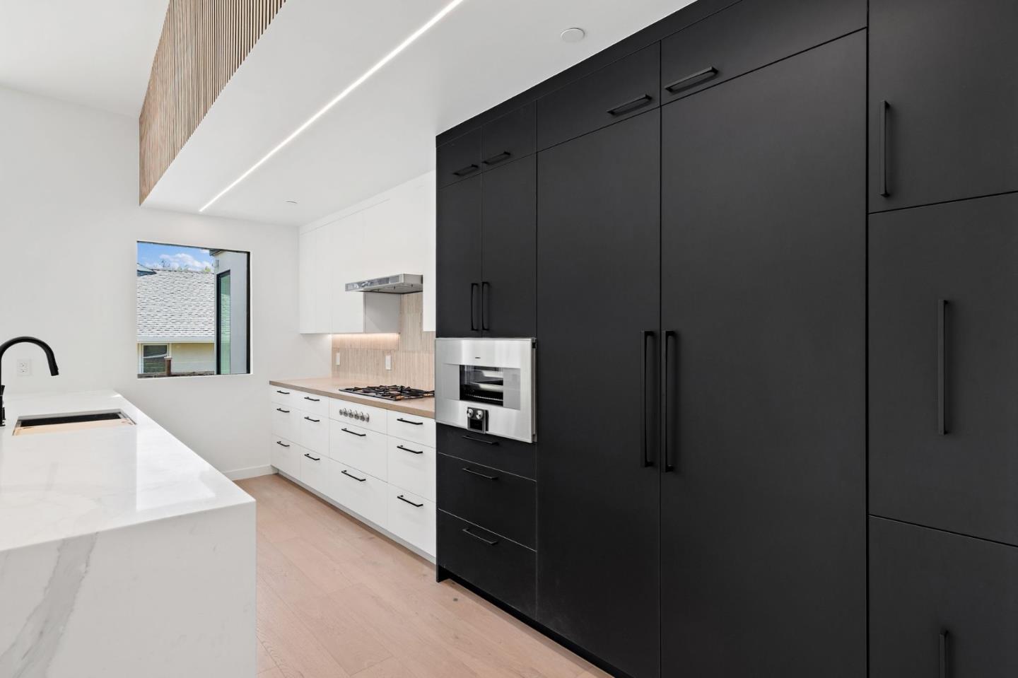 3886 Ross Road Palo Alto, CA 94303 - Photo 15 of 60 a kitchen with a refrigerator and cabinets