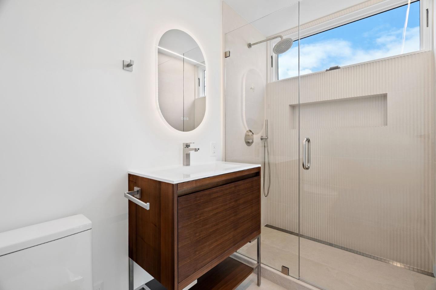 3886 Ross Road Palo Alto, CA 94303 - Photo 23 of 60 a bathroom with a sink and a mirror