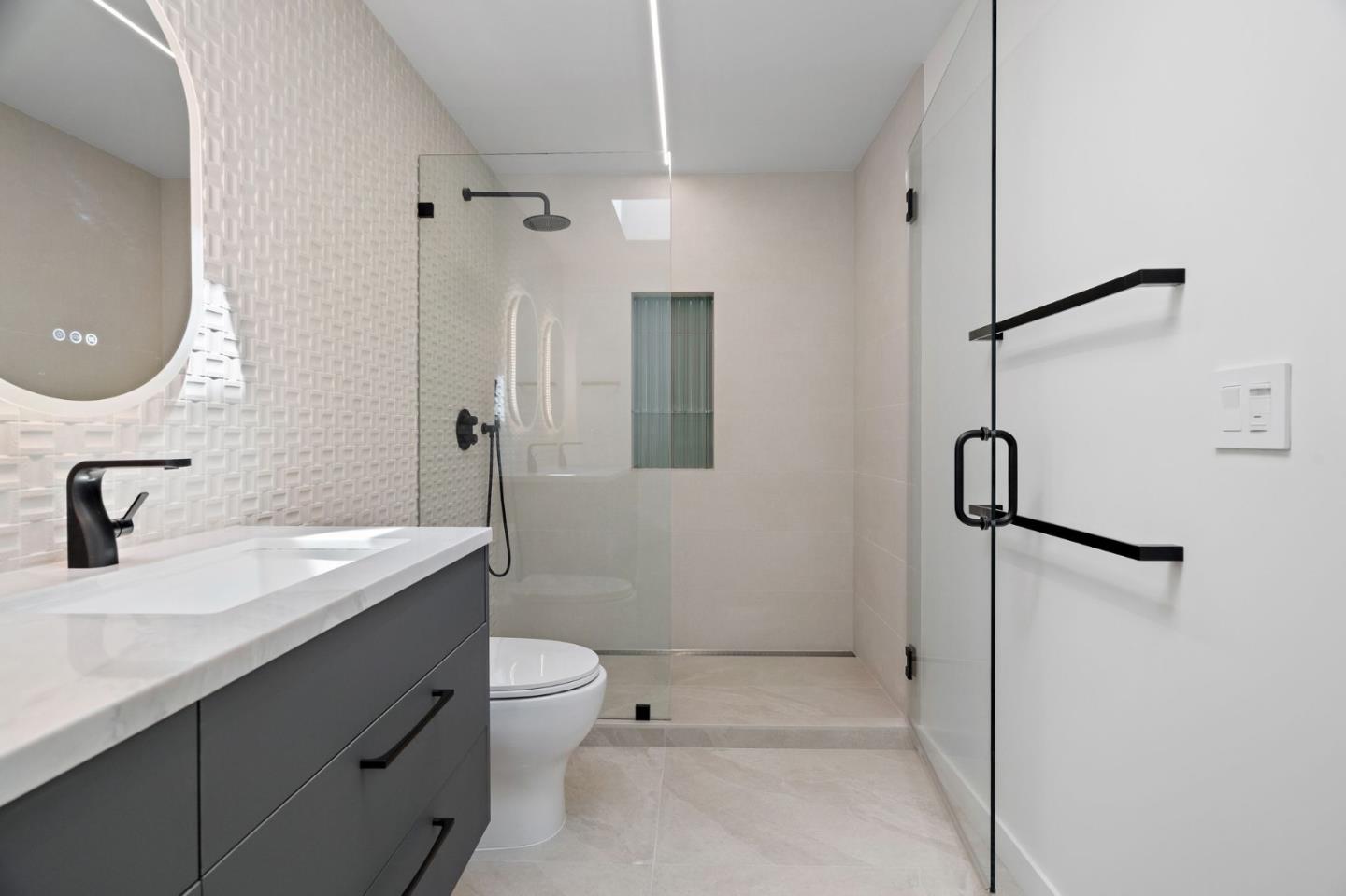 3886 Ross Road Palo Alto, CA 94303 - Photo 30 of 60 a bathroom with a sink a toilet and shower