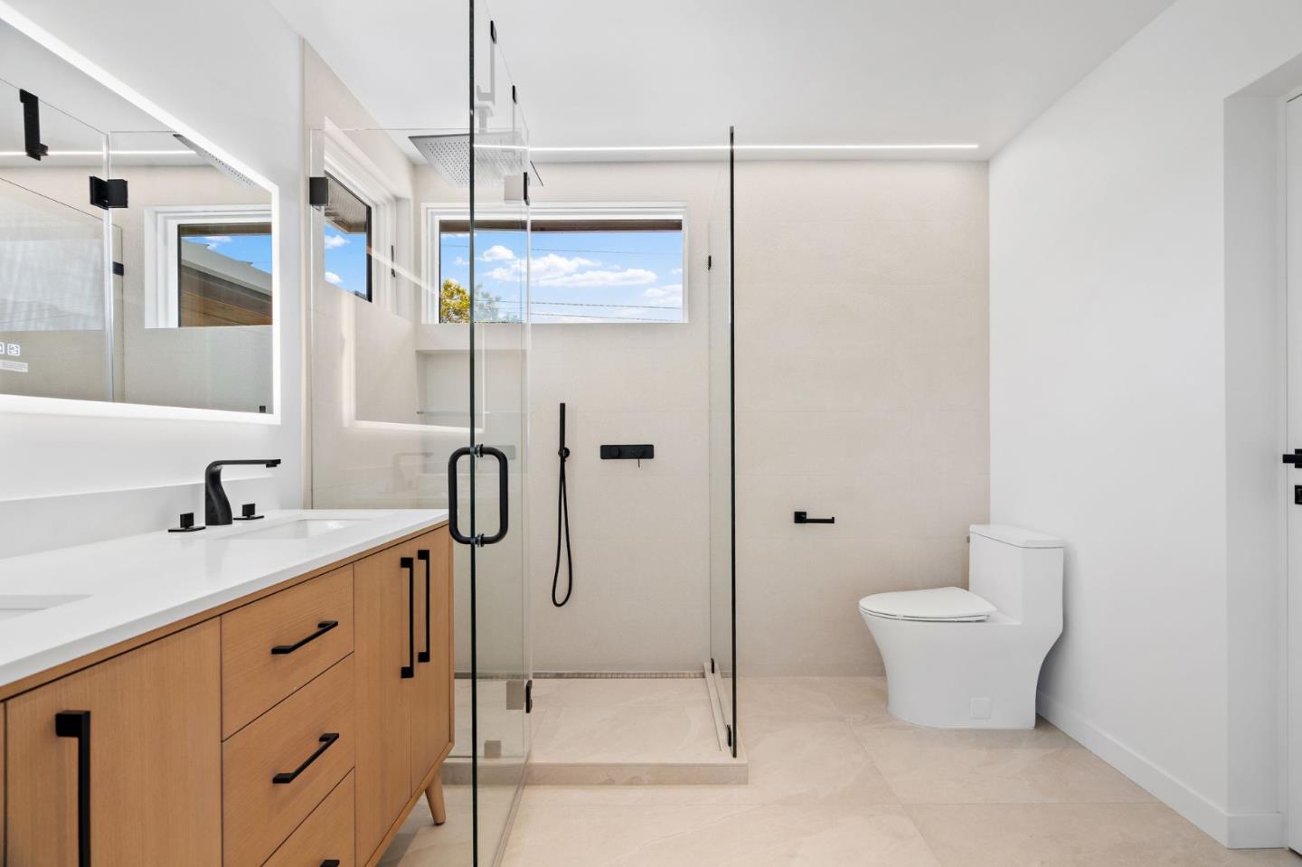 3886 Ross Road Palo Alto, CA 94303 - Photo 34 of 60 a bathroom with a granite countertop sink a toilet and shower