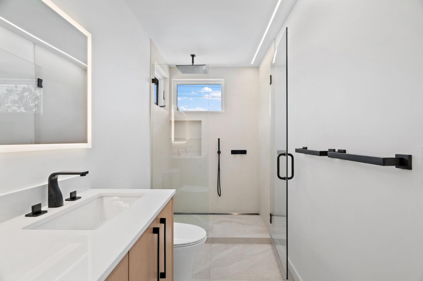 3886 Ross Road Palo Alto, CA 94303 - Photo 40 of 60 a bathroom with a sink toilet and shower