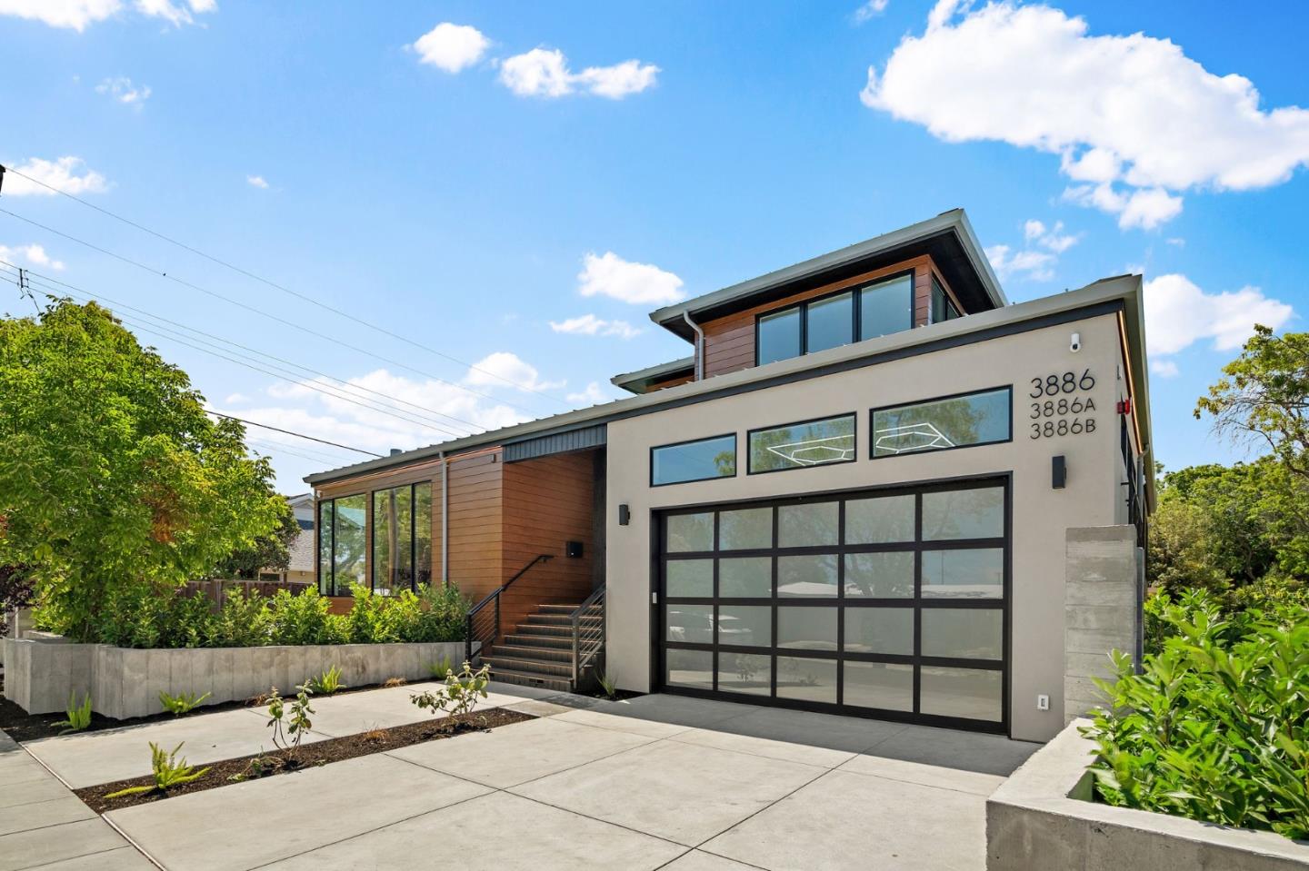 3886 Ross Road Palo Alto, CA 94303 - Photo 4 of 60 a front view of a house with a garage