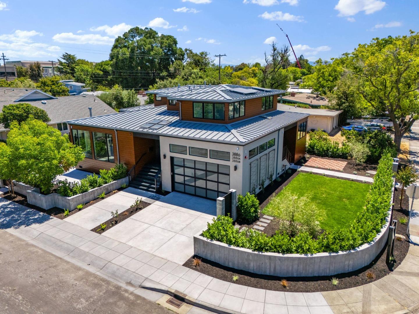 3886 Ross Road Palo Alto, CA 94303 - Photo 49 of 60 a aerial view of a house with a garden and deck