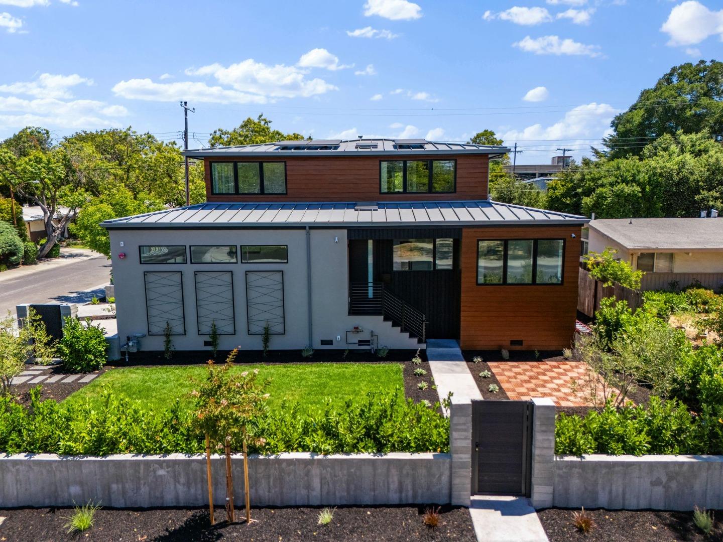 3886 Ross Road Palo Alto, CA 94303 - Photo 50 of 60 a front view of a house with a yard table and chairs