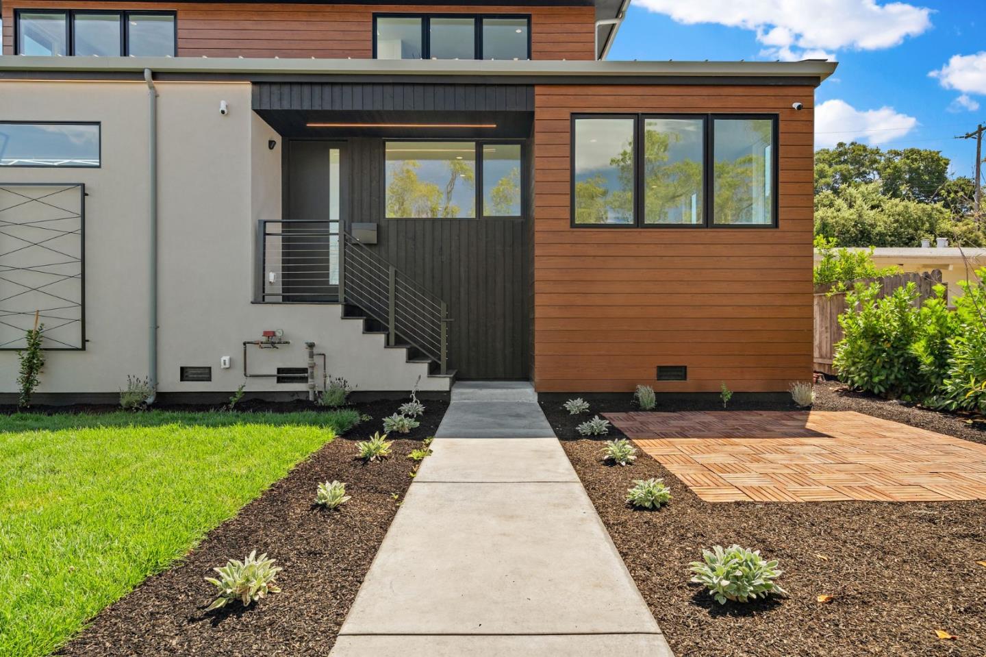 3886 Ross Road Palo Alto, CA 94303 - Photo 6 of 60 a view of a brick house with many windows