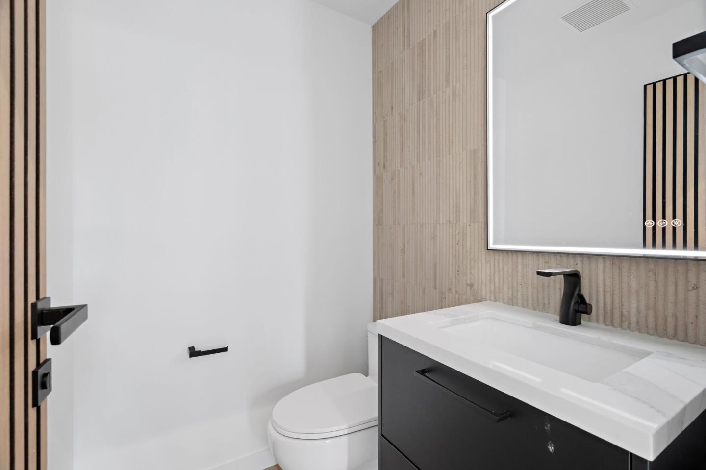 3886 Ross Road Palo Alto, CA 94303 - Photo 8 of 60 a bathroom with a sink toilet and mirror