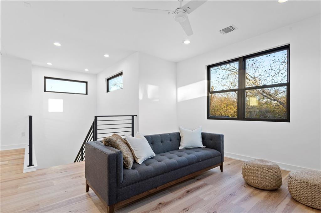 1004 Lott Avenue Austin, TX 78721 - Photo 24 of 39 a living room with furniture and a window