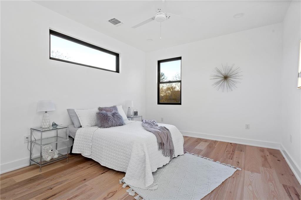 1004 Lott Avenue Austin, TX 78721 - Photo 28 of 39 a bedroom with a bed and window