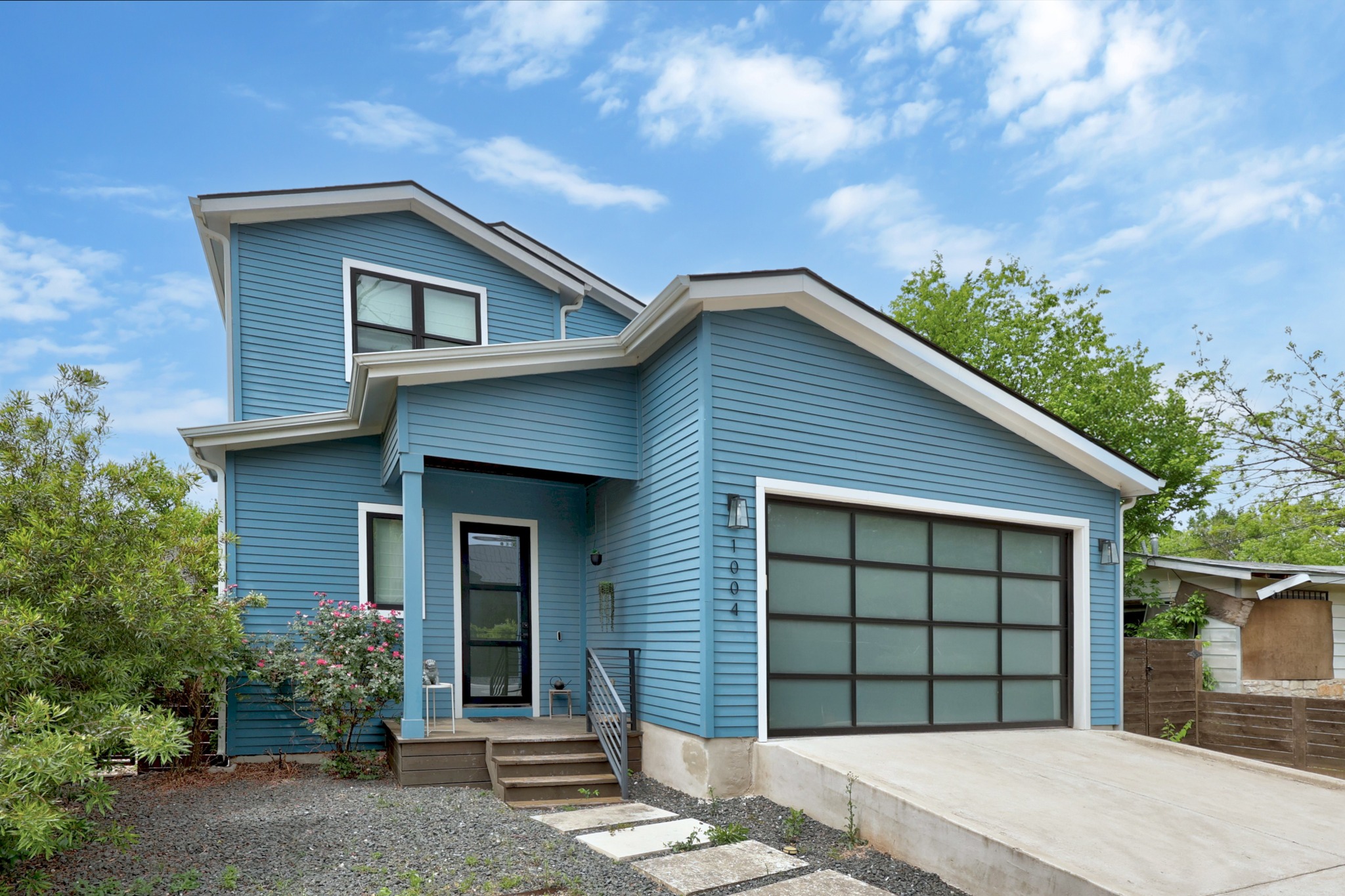 1004 Lott Avenue Austin, TX 78721 - Photo 5 of 39 a front view of a house with a garden