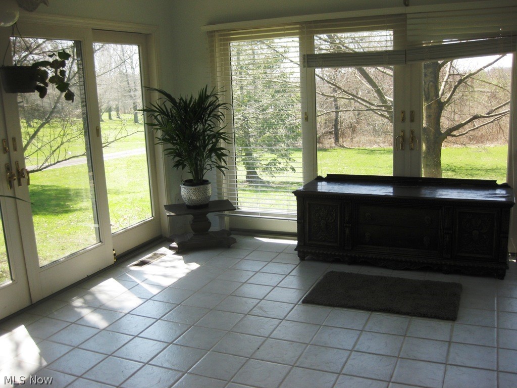 6152 Ridge Road Wadsworth, OH 44281 - Photo 5 of 33 View of bright and cheerful sunroom.